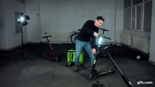 gif image of a man slamming an electric scooter